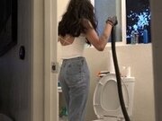 'Bombshell Desi Girl Vacuuming the Bathroom in Crop Top and Jeans'