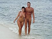 This woman seems to be obsessed with her hubby's hard cock on the beach