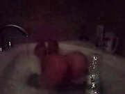 Enjoying a Bubble Bath in the Dark Early Morning