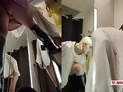 Bottom view in public fitting room on pussy of blonde with big tits