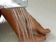 Aquatic Seduction: Footjob and Dildo in the Shower