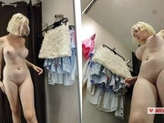 Girl in transparent clothes trying on clothes without panties