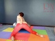'A girl without panties is engaged in yoga. The athlete takes off yoga leotards and shows her pussy.'