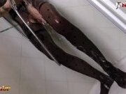"Tattooed redhead takes a shower and masturbates in catsuit"