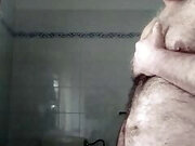 Davide the pig is in the bathroom, he undresses, he pees in a cut plastic bottle and I show his beautiful big ass.