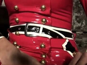 Blonde shemale in red latex dress plays with her huge tits