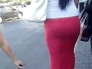 Long-haired woman wearing a sexy skirt gets caught on my hidden cam