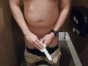 Shirtless in toilet stall cum