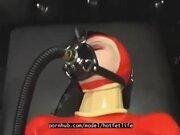 'Hot girl full encased in red rubber suit enjoys gas mask breathplay in her black room'