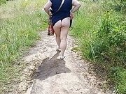 fat woman walks through the park shows her ass and masturbates