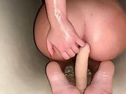 Dildo in the shower of a beauty with a tight pussy.