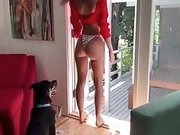 Emily Ratajkowski in a red shirt and white thong
