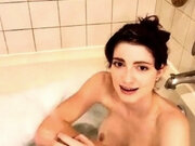 Redhead with huge tits takes a bath
