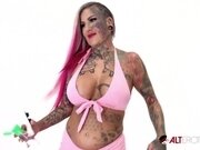 'Big titty inked up hottie rides a big vibrating toy'