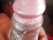 A South Asian young man is engaging in self-pleasure at home.